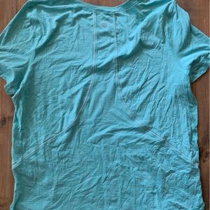 Light blue lululemon tshirt.